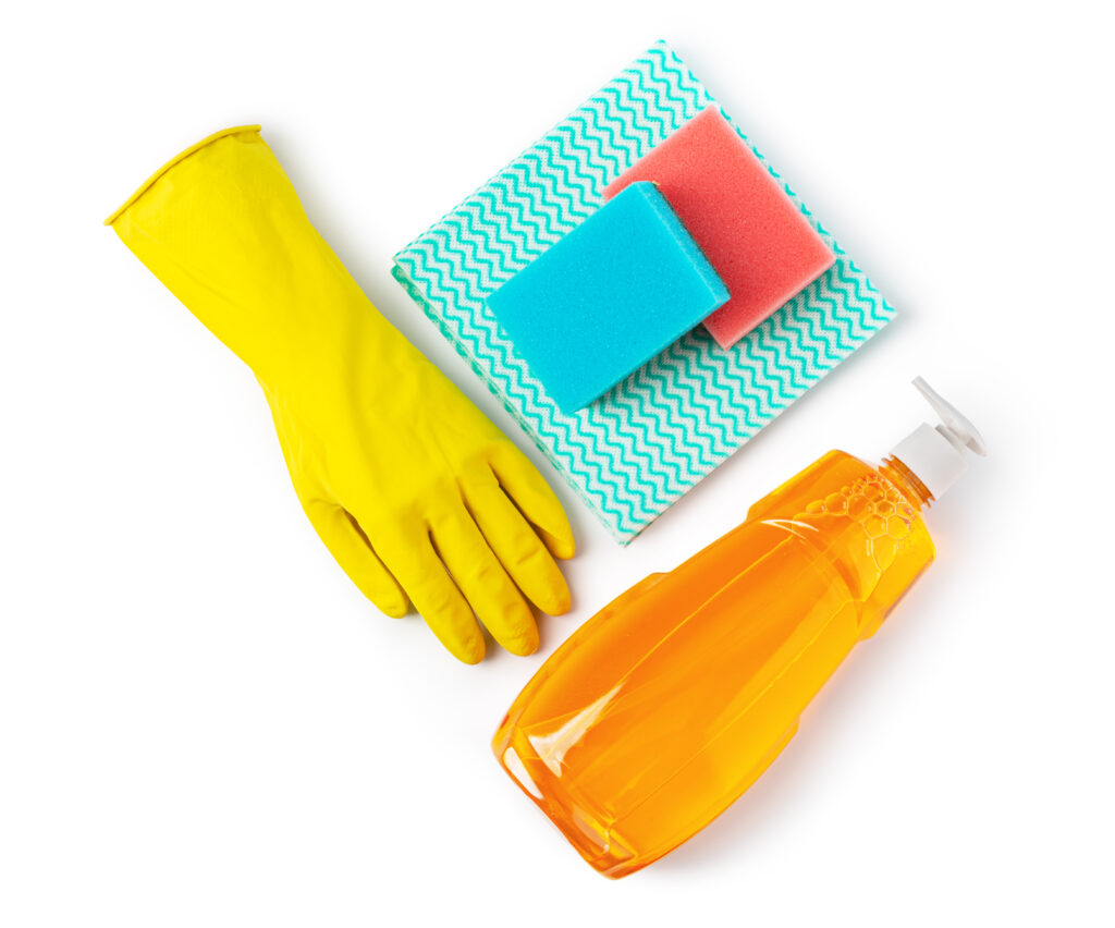 Cleaning products. Sponge, detergent, and cloth for household cleaning.