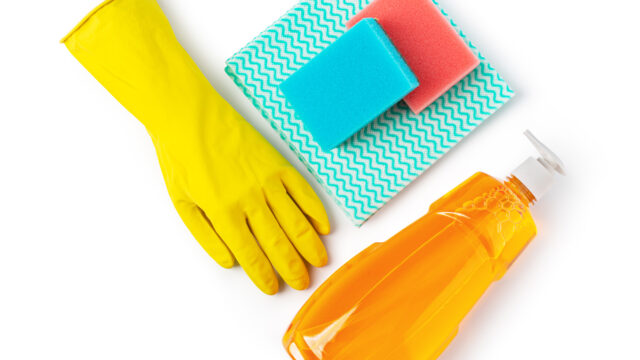 Cleaning products. Sponge, detergent, and cloth for household cleaning.
