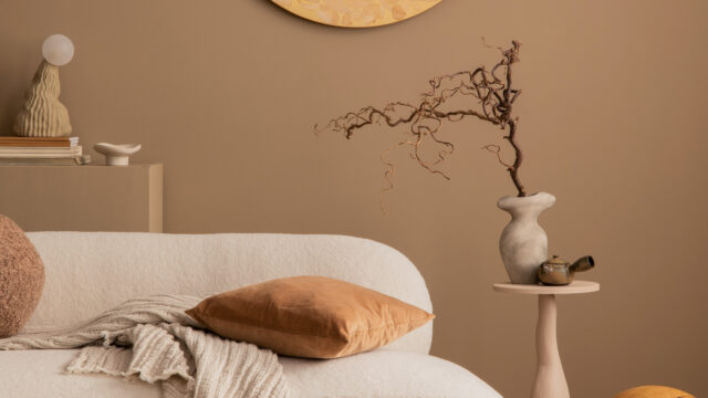 Warm and cozy living room interior with round wall panel, stylis